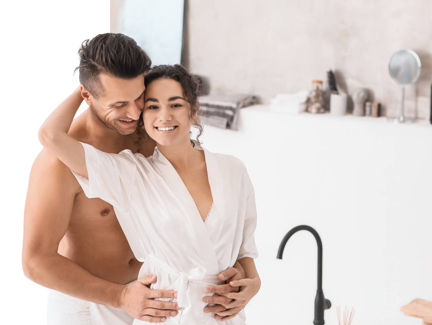 Two people in a bright white bathroom, the setting this store's own home page uses